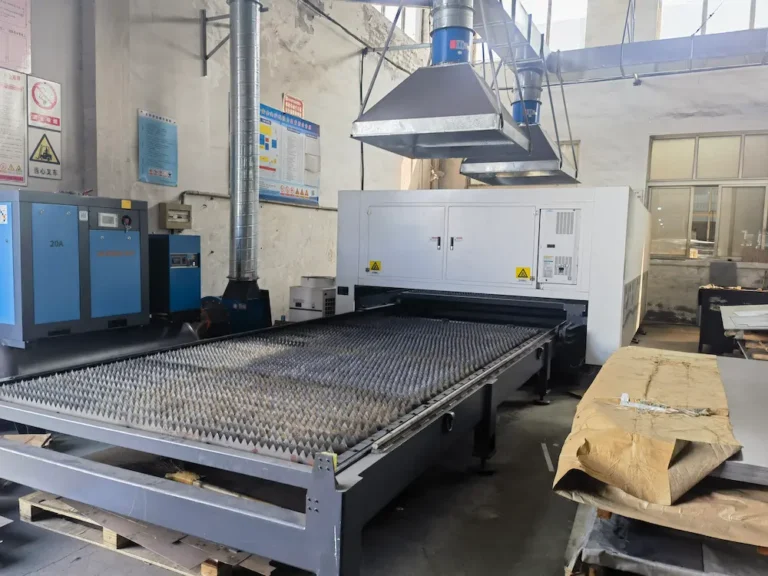 Cnc Laser Cutting Machine In A Factory With Ventilation Ducts And Control Panels