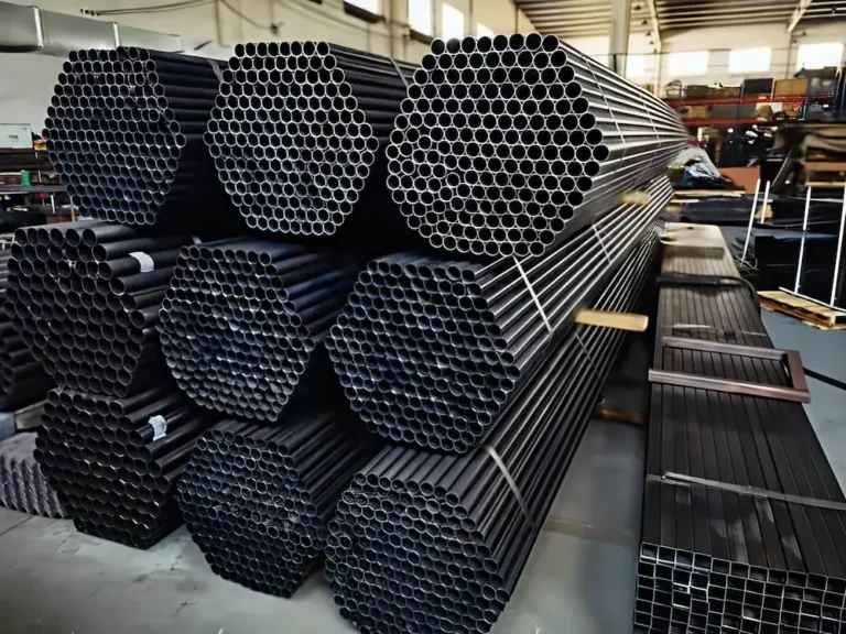 Bundles Of Steel Pipes And Square Tubing Stacked In An Industrial Warehouse