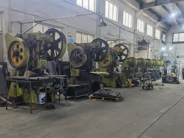 Line Of Mechanical Power Press Machines In An Industrial Metalworking Facility